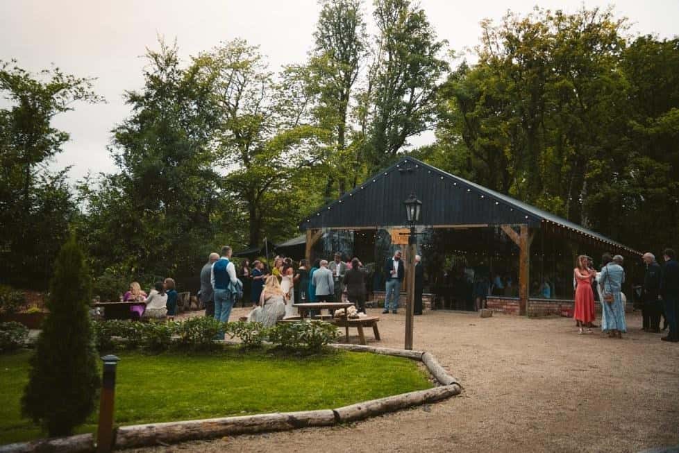 Wedding celebration under the outdoor canopy at Drumhierny woodland estate